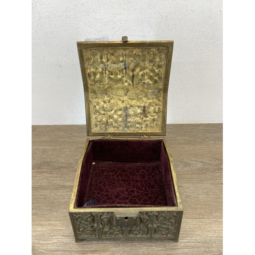 427C - A 19th century Gothic Revival Adolph Frankau & Co. brass casket shaped jewellery box with red velvet... 