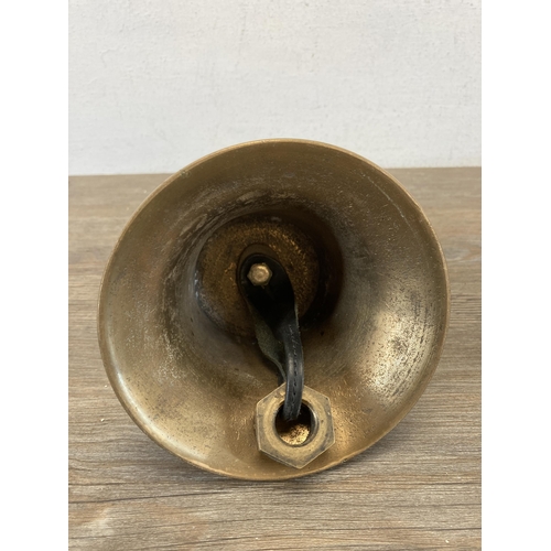 427D - A 19th century brass bell with cast pigeon top - approx. 21cm high x 14cm diameter