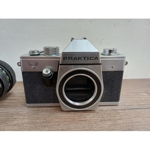 633 - Four Pentacon Praktica items, one BCA Electronic 35mm SLR camera fitted with Soligor f=35mm 1:3.5 wi... 