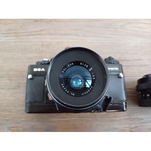 633 - Four Pentacon Praktica items, one BCA Electronic 35mm SLR camera fitted with Soligor f=35mm 1:3.5 wi... 