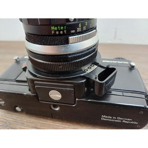 633 - Four Pentacon Praktica items, one BCA Electronic 35mm SLR camera fitted with Soligor f=35mm 1:3.5 wi... 