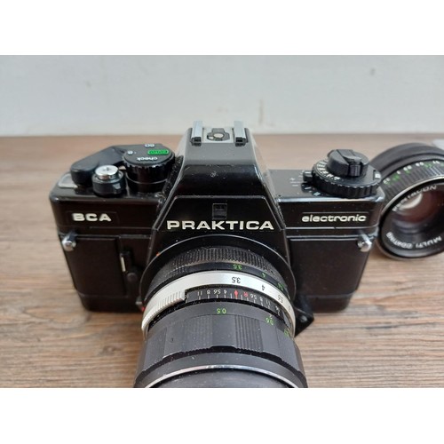 633 - Four Pentacon Praktica items, one BCA Electronic 35mm SLR camera fitted with Soligor f=35mm 1:3.5 wi... 