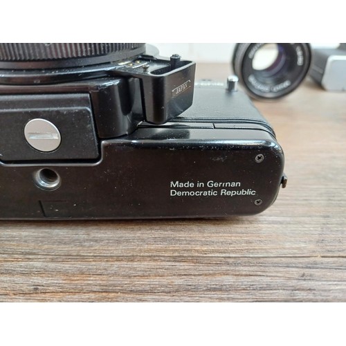 633 - Four Pentacon Praktica items, one BCA Electronic 35mm SLR camera fitted with Soligor f=35mm 1:3.5 wi... 