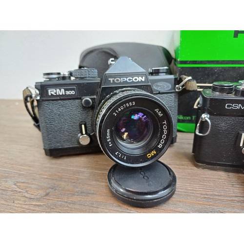 638 - Five 35mm SLR cameras, one boxed Fujica ST705w, one cased KMZ Zenit-E fitted with Helios-44-2 2/58 l... 