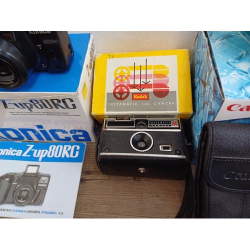 639 - A collection of boxed cameras to include Konica Z-up80RC, Kodak Intamatic 100 and 304, Konica EU-min... 