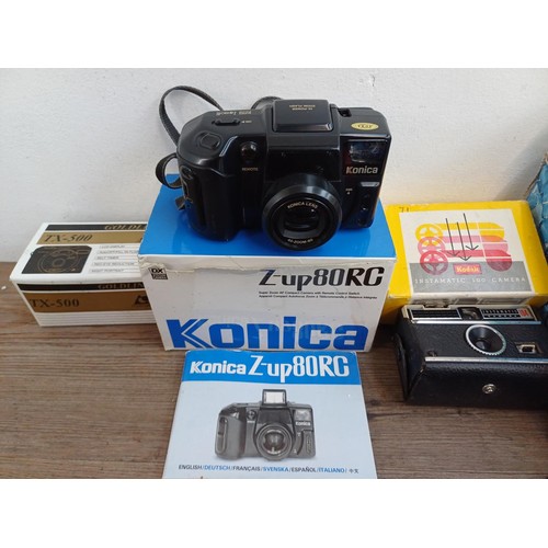 639 - A collection of boxed cameras to include Konica Z-up80RC, Kodak Intamatic 100 and 304, Konica EU-min... 