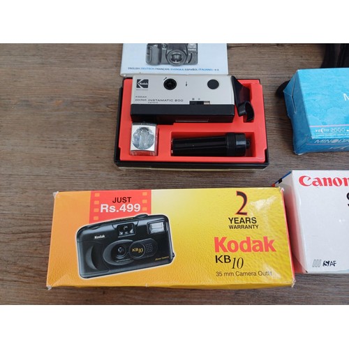 639 - A collection of boxed cameras to include Konica Z-up80RC, Kodak Intamatic 100 and 304, Konica EU-min... 