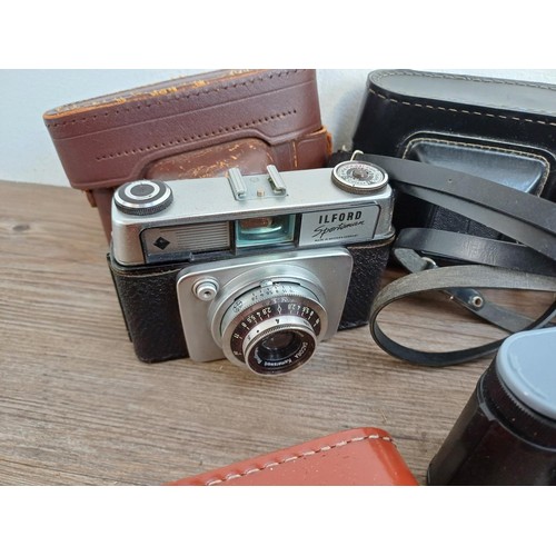 644 - A collection of vintage cameras to include Konica Auto S2, Coronet Viscount, Braun Paxette and Paxin... 