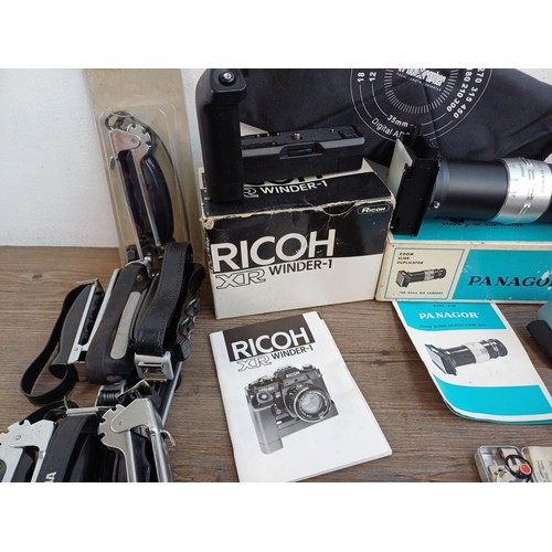 650 - A collection of photography accessories to include boxed Ricoh XR Winder-1, boxed Panagor zoom slide... 