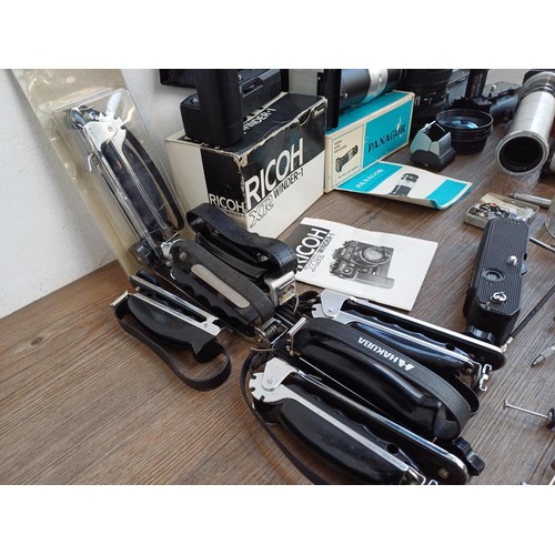 650 - A collection of photography accessories to include boxed Ricoh XR Winder-1, boxed Panagor zoom slide... 