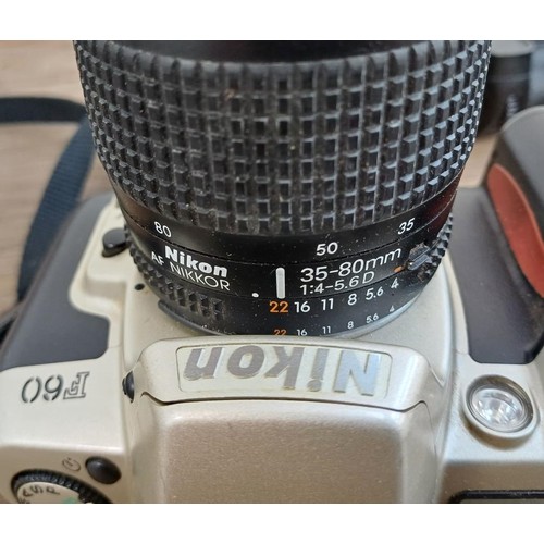 651 - Two Nikon 35mm autofocus SLR cameras, one F-501 fitted with Mitakon MC 80-200mm 1:4.5 zoom lens and ... 