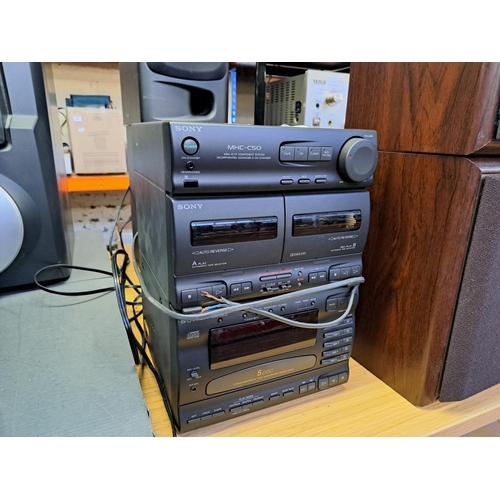 673 - A Sony MHC-C50 mini hi-fi system comprising five-disc-changer CD player, twin Dolby B cassette deck,... 