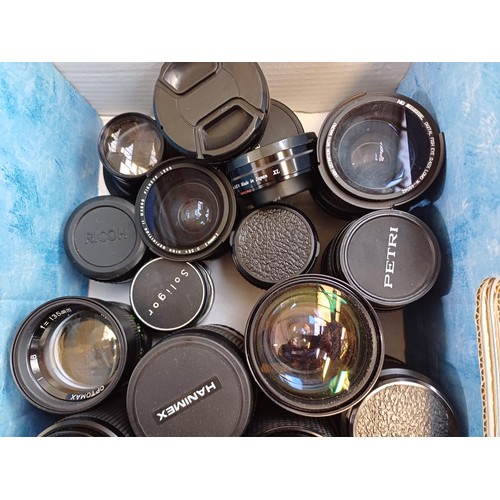 668 - A collection of lenses to include Hanimex, Miranda, Petri etc.