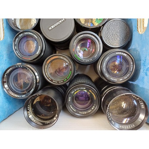 668 - A collection of lenses to include Hanimex, Miranda, Petri etc.