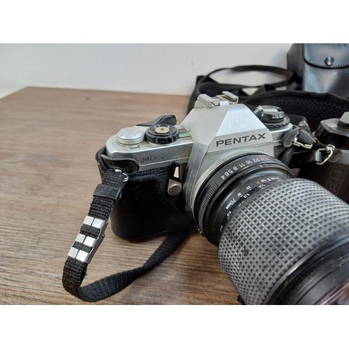 669 - A collection of Pentax items to include MG, P30N, MZ-50 and P30T 35mm SLR cameras etc.