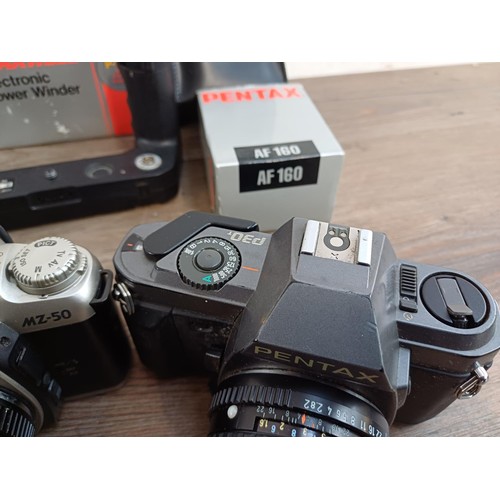 669 - A collection of Pentax items to include MG, P30N, MZ-50 and P30T 35mm SLR cameras etc.