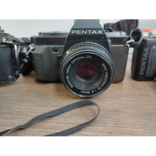 669 - A collection of Pentax items to include MG, P30N, MZ-50 and P30T 35mm SLR cameras etc.