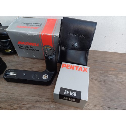 669 - A collection of Pentax items to include MG, P30N, MZ-50 and P30T 35mm SLR cameras etc.