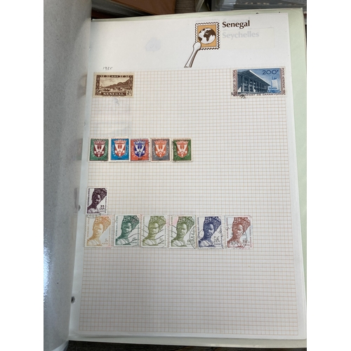 497 - Seven albums containing a large collection of worldwide stamps