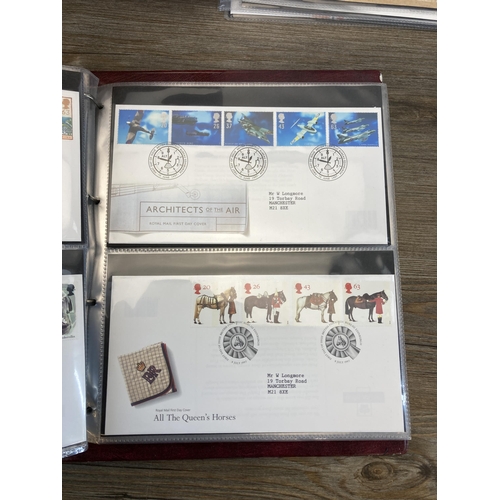 498 - Six albums containing a large collection of Royal Mail first day covers to include Winnie the Pooh, ... 