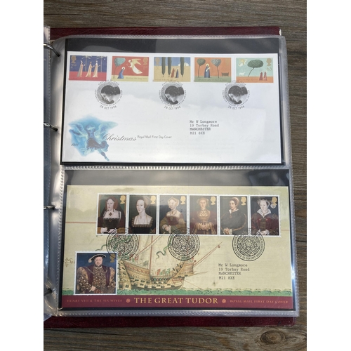 498 - Six albums containing a large collection of Royal Mail first day covers to include Winnie the Pooh, ... 