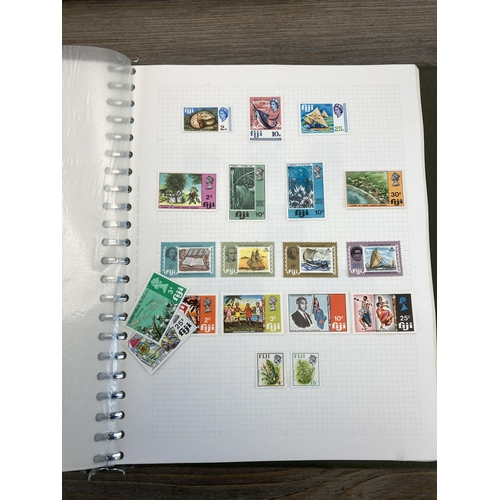 503 - Eight albums containing a collection of worldwide stamps