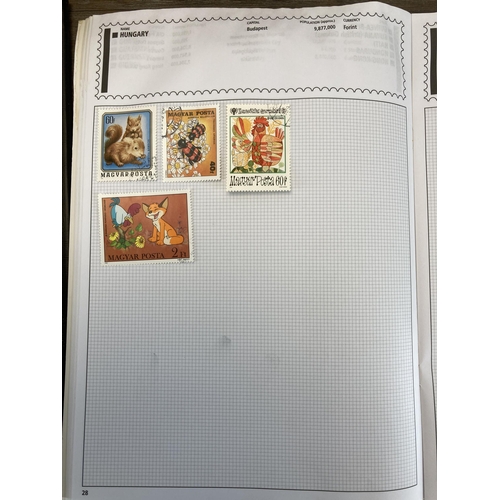 504 - Eight albums containing a collection of worldwide stamps