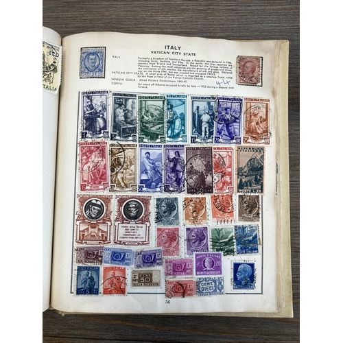 514 - An album containing a collection of worldwide stamps together with a collection of cigarette cards