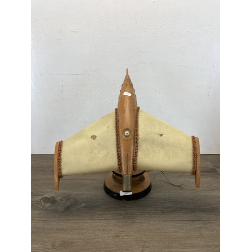 532 - A mid 20th century beech jet plane table lamp