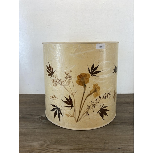 533 - A vintage cylindrical table lamp shade with natural pressed flower and leaf design - approx. 38.5cm ... 