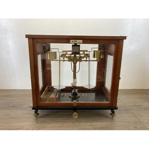 538 - A set of early 20th century L. Oertling of London mahogany cased analytical balance scales - approx.... 