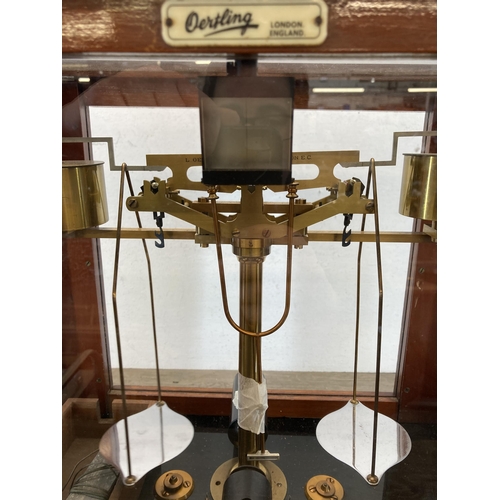 538 - A set of early 20th century L. Oertling of London mahogany cased analytical balance scales - approx.... 