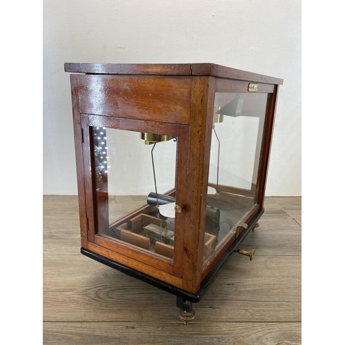 538 - A set of early 20th century L. Oertling of London mahogany cased analytical balance scales - approx.... 