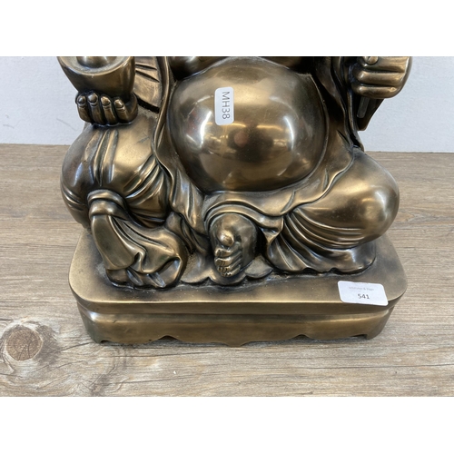 541 - A large contemporary gold painted seated Buddha figurine - approx. 48cm high x 28cm wide