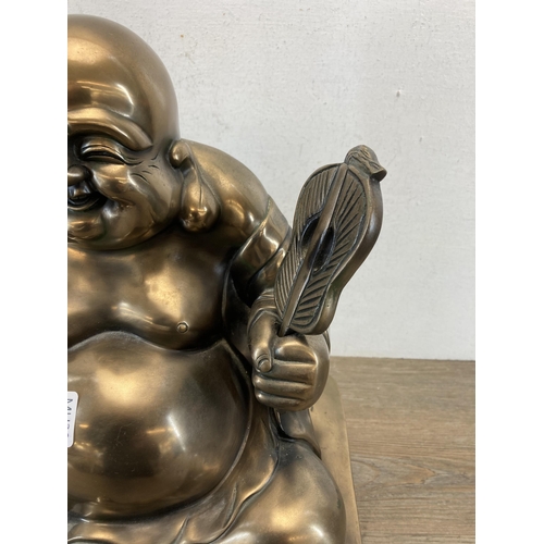 541 - A large contemporary gold painted seated Buddha figurine - approx. 48cm high x 28cm wide