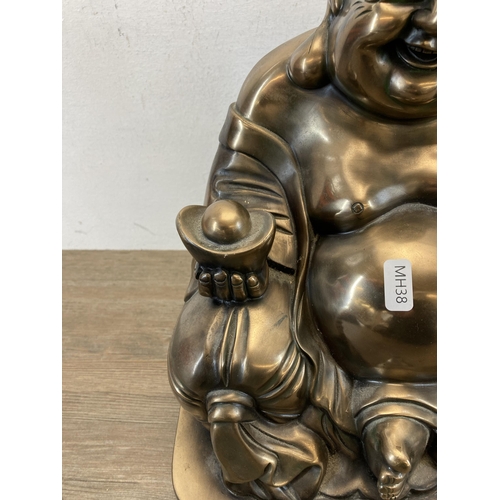 541 - A large contemporary gold painted seated Buddha figurine - approx. 48cm high x 28cm wide