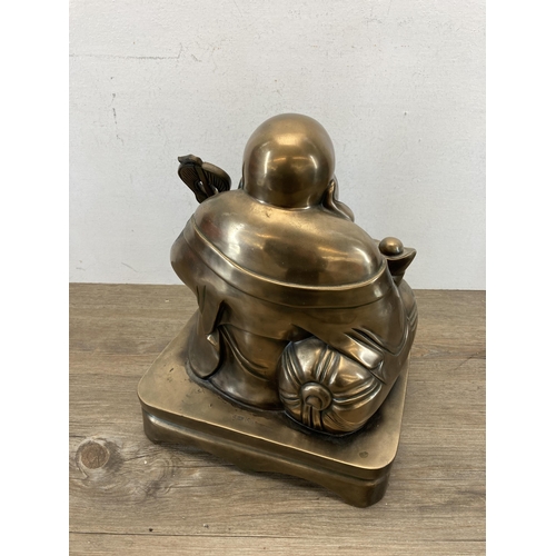 541 - A large contemporary gold painted seated Buddha figurine - approx. 48cm high x 28cm wide