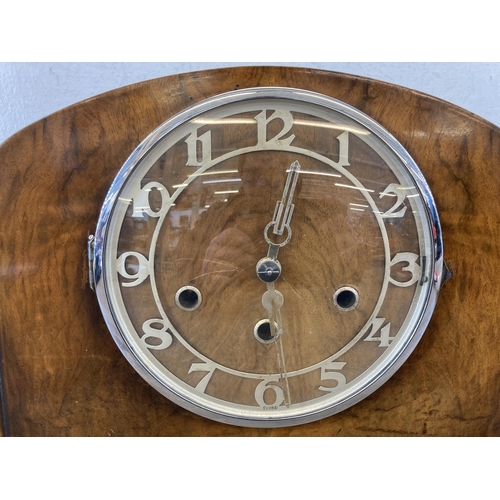 544 - An Art Deco walnut cased Westminster chiming mantel clock - approx. 23cm high x 44cm wide x 16cm dee... 