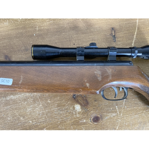 551 - A Weihrauch HW80 cal 5.5 air rifle with Nikko Stirling Tiara 4x28 scope together with black plastic ... 