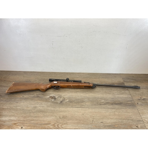 552 - A vintage B.S.A Guns Ltd 0.22Kal air rifle with matching scope