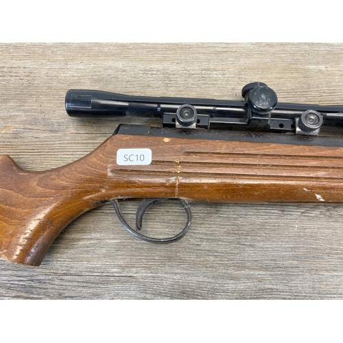 552 - A vintage B.S.A Guns Ltd 0.22Kal air rifle with matching scope