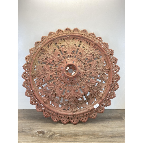 557 - A Victorian cast iron ceiling rose - approx. 76cm diameter