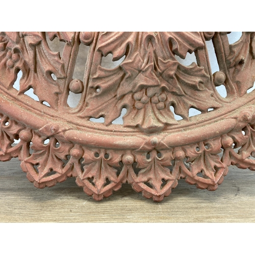 557 - A Victorian cast iron ceiling rose - approx. 76cm diameter