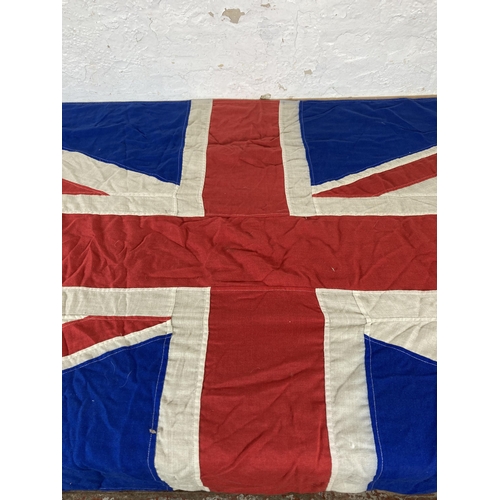 561 - A large WWII era Union Jack flag - approx. 230cm long x 105cm wide