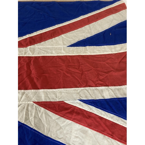 561 - A large WWII era Union Jack flag - approx. 230cm long x 105cm wide