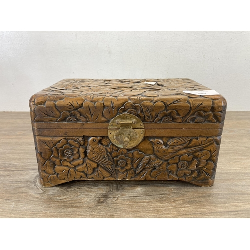 564 - A vintage Chinese carved hardwood jewellery box with bird and foliate design - approx. 12cm high x 2... 