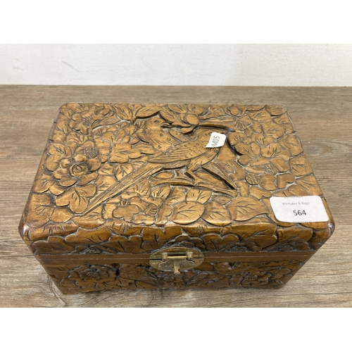 564 - A vintage Chinese carved hardwood jewellery box with bird and foliate design - approx. 12cm high x 2... 