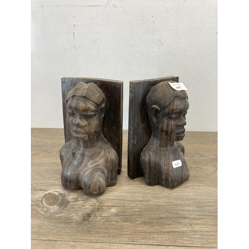 565 - A pair of African carved rosewood figural book ends - approx. 21cm high x 12cm deep