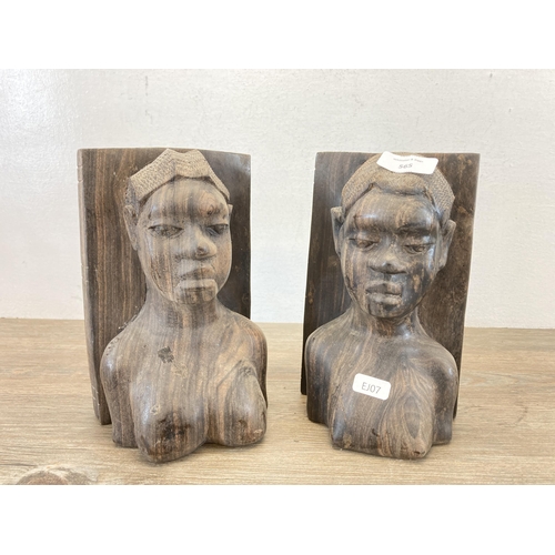 565 - A pair of African carved rosewood figural book ends - approx. 21cm high x 12cm deep