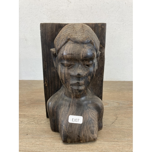 565 - A pair of African carved rosewood figural book ends - approx. 21cm high x 12cm deep